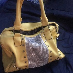 Cute yellow purse with bling. Lightly used.